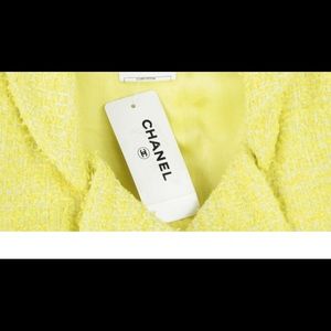 Brand new Chanel tweed dress with beautiful buttons. Head turner for sure.